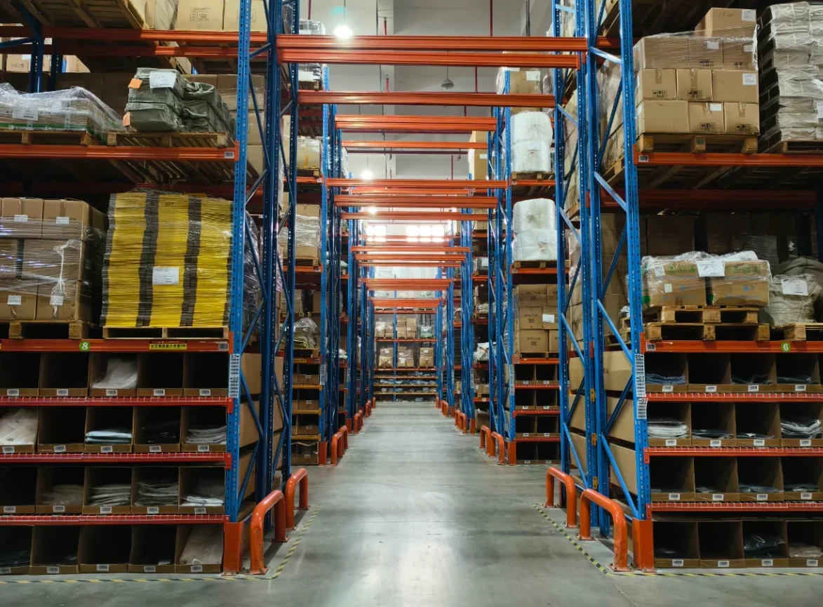 Warehouse aisle with pallet racks and cartons