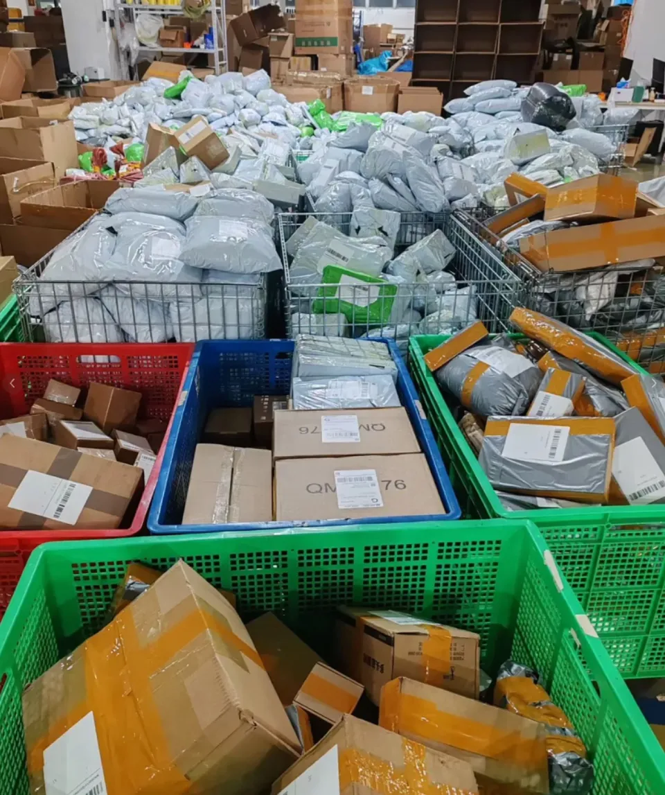 Parcels and cartons in warehouse sorting baskets