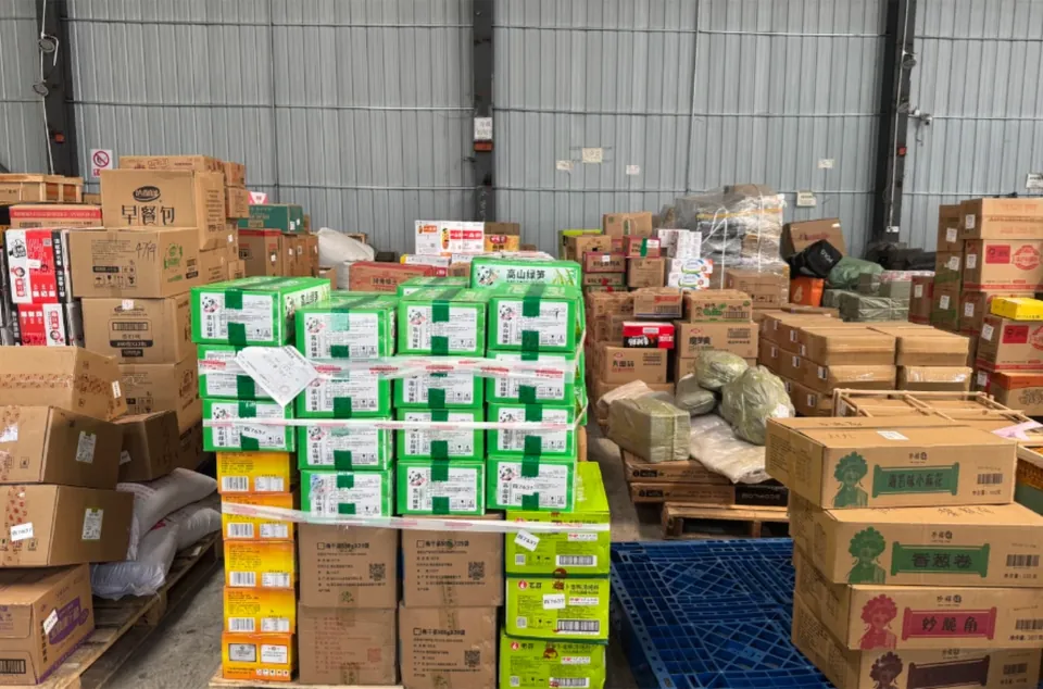Cartons on pallets in a warehouse receiving area